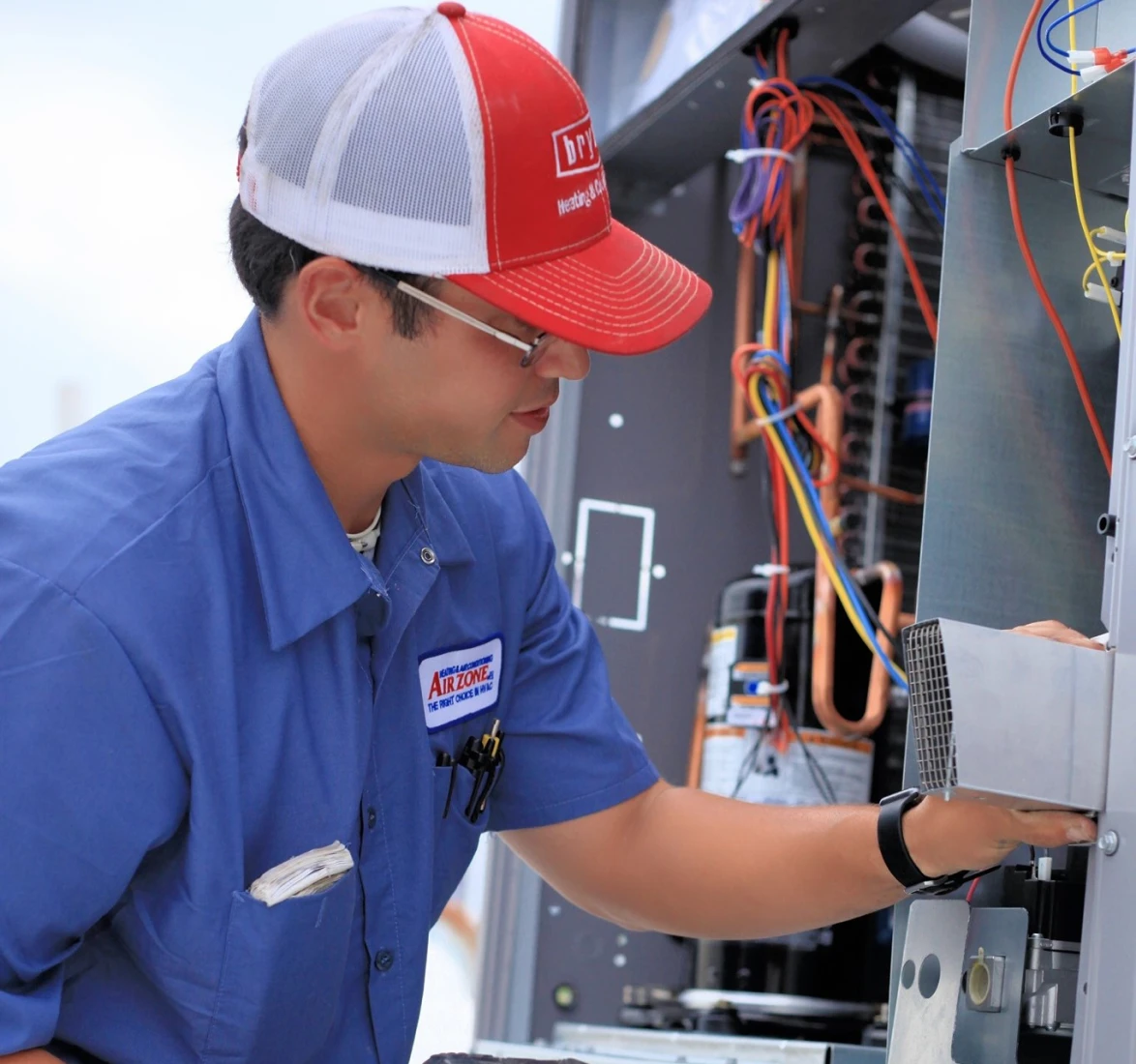 Maintenance worker adjusting machinery