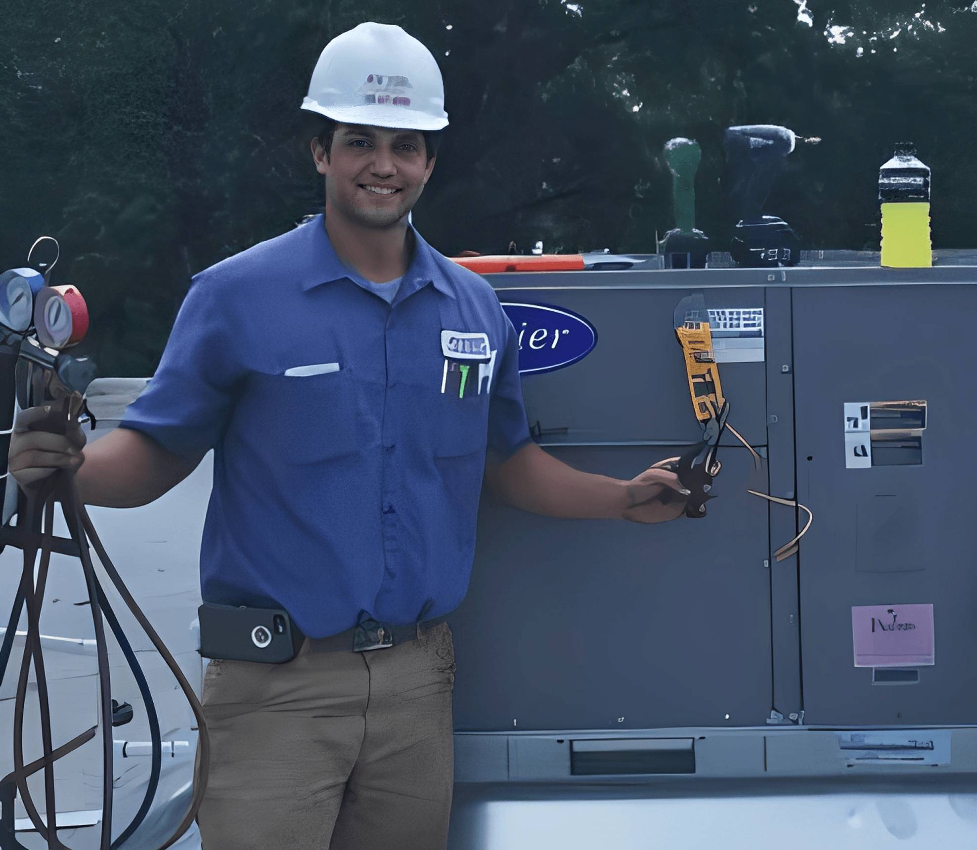 Smiling worker beside air conditioning unit