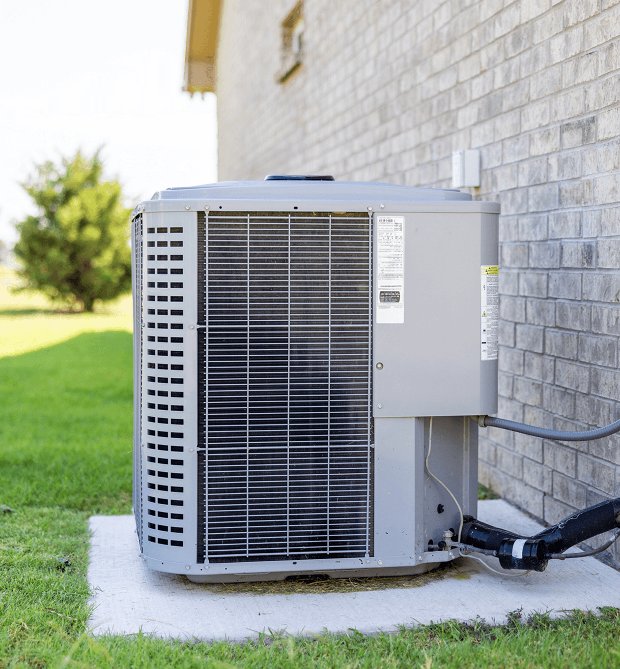 Outdoor air conditioning unit on concrete slab.